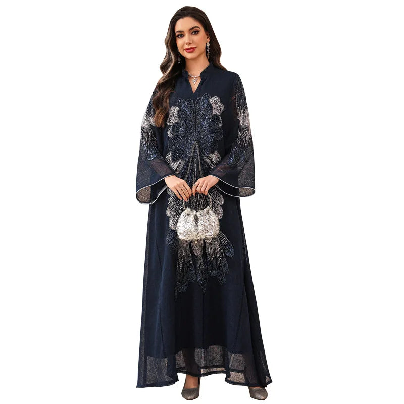 Robe Meryem pailletée — détail ceinture et découpe élégante