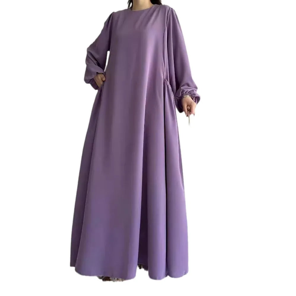 Robe Sirine — détail des manches longues et finition soignée