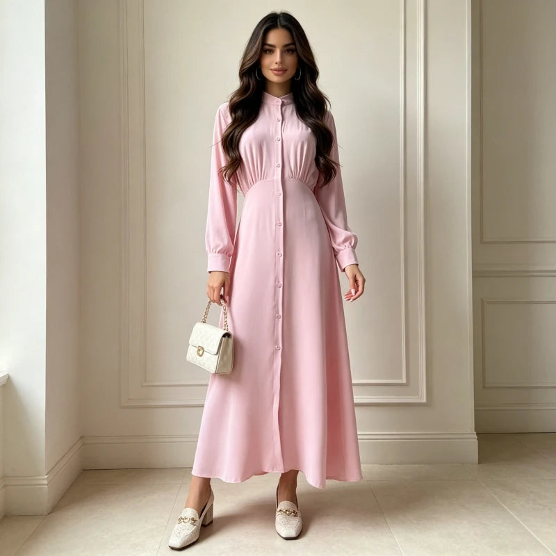 Robe Anissa rose — vue de profil, manches longues et tombé maxi