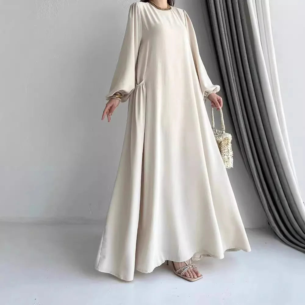 Robe Sirine — détail du bas et poches discrètes aux chevilles